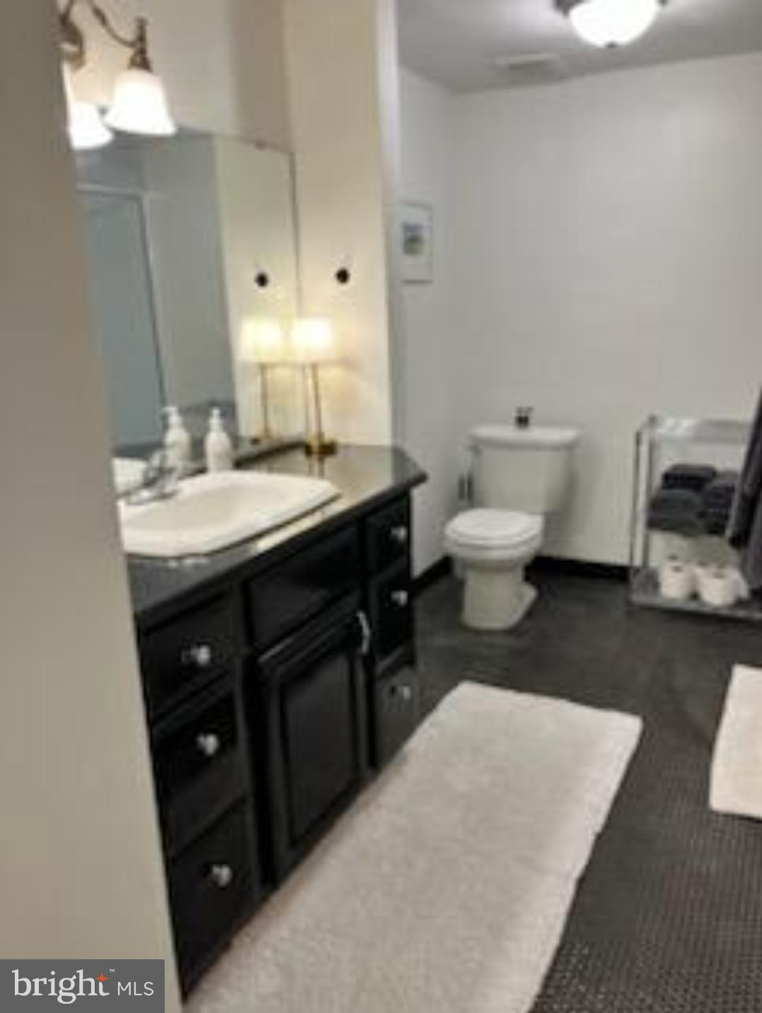 1703 Yardley Commons Yardley, PA 19067 - Photo 18 of 23 a bathroom with a sink and a mirror