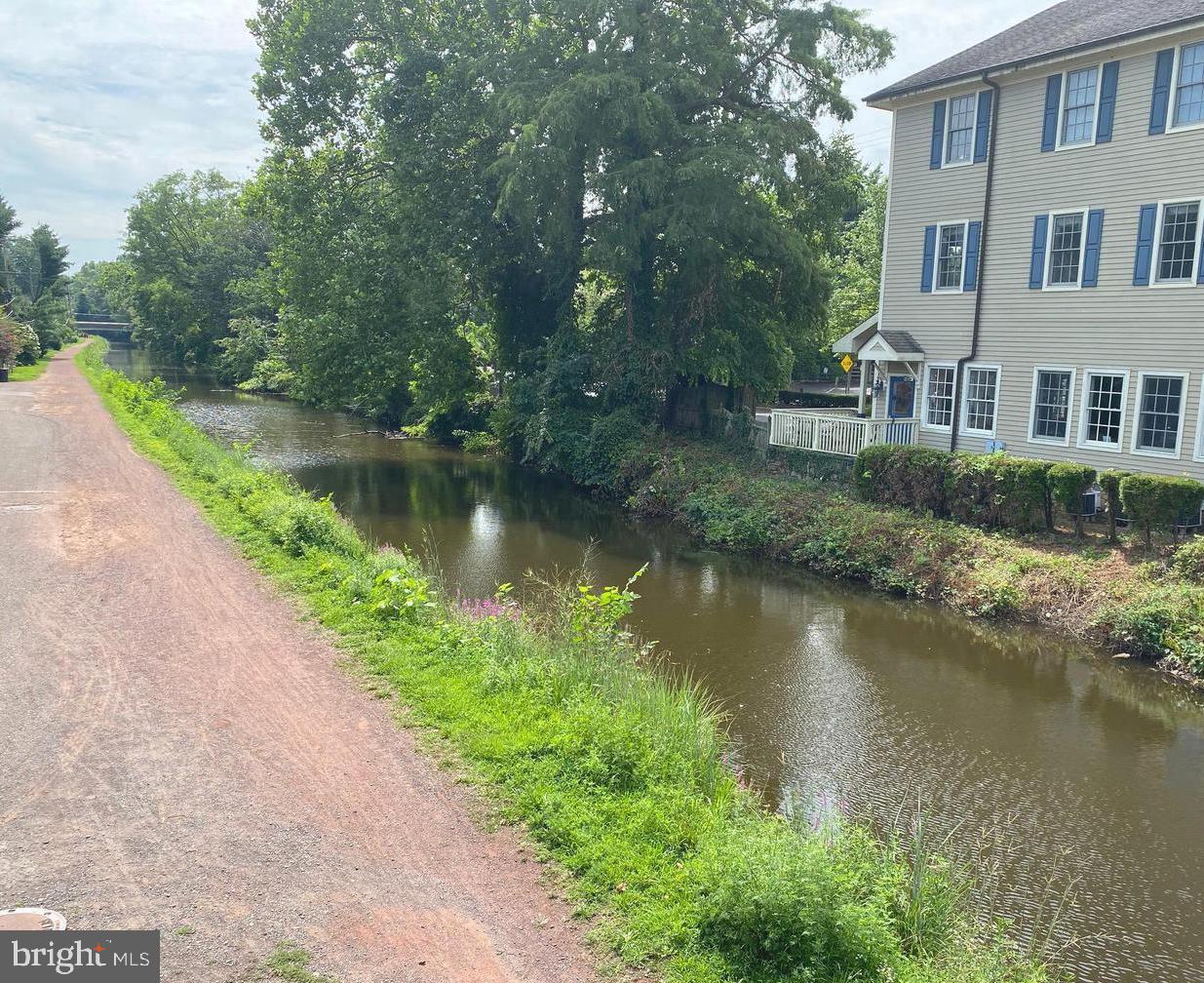 1703 Yardley Commons Yardley, PA 19067 - Photo 21 of 23 an aerial view of a house with garden space and a lake view