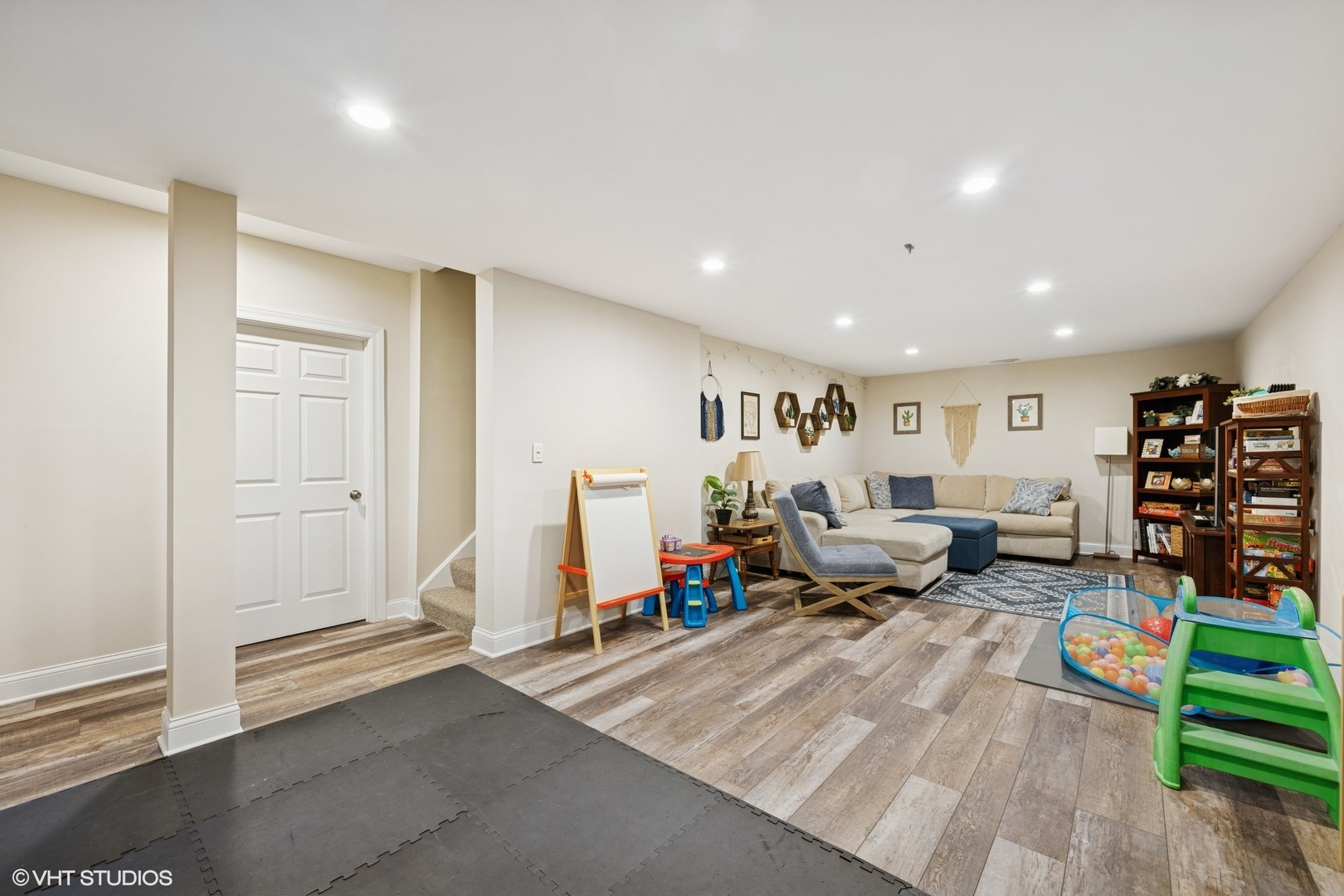 1046 Prairie Trail Grayslake, IL 60030 - Photo 14 of 17 a living room with lots of furniture and a wooden floor