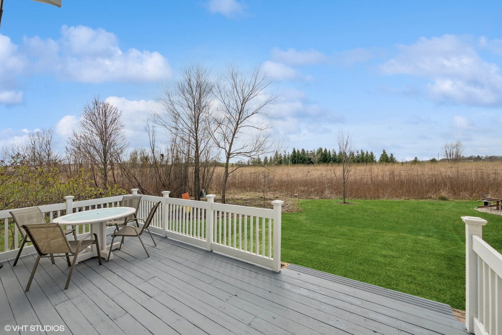1046 Prairie Trail Grayslake, IL 60030 - Photo 16 of 17 a view of a wooden deck and a yard