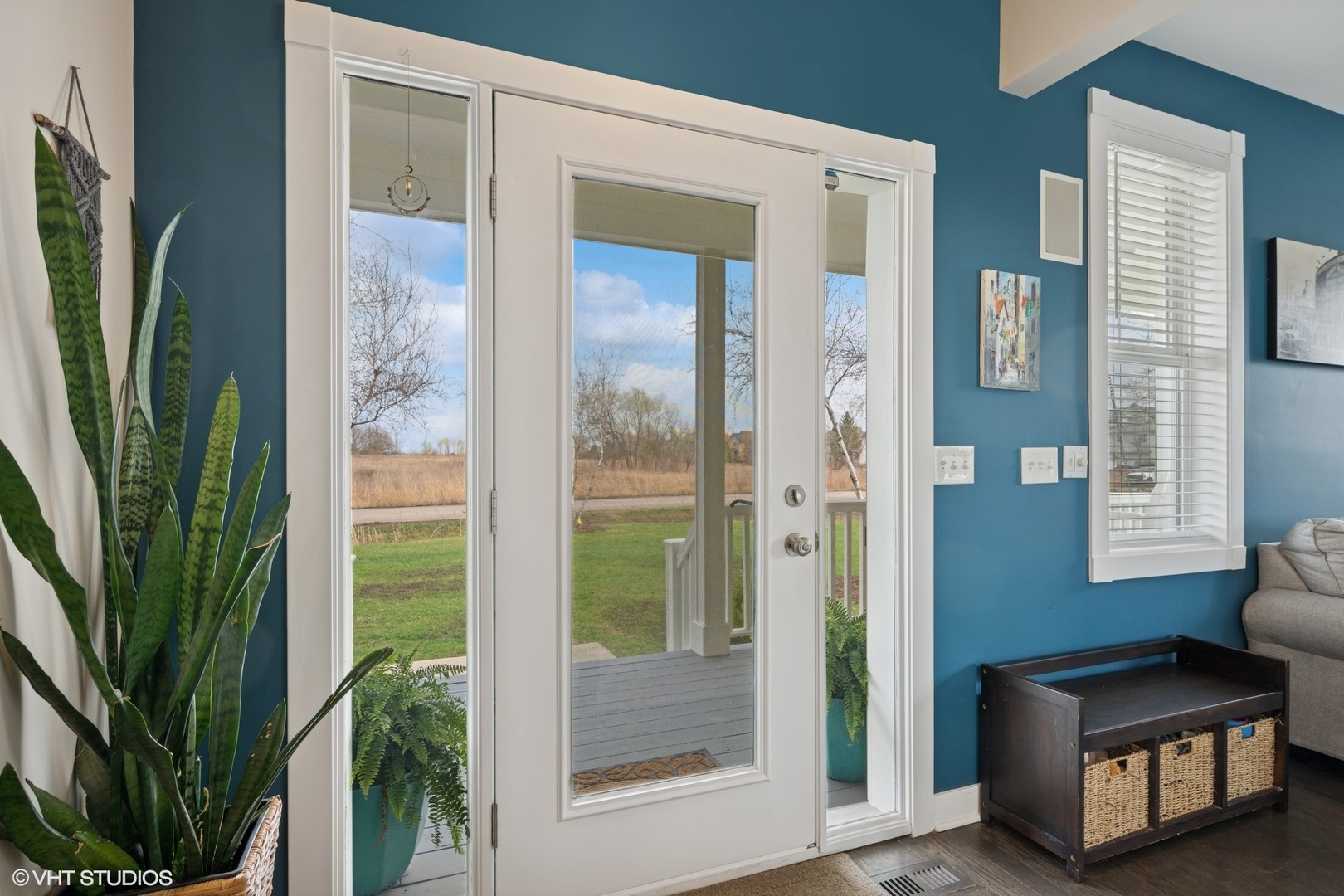 1046 Prairie Trail Grayslake, IL 60030 - Photo 2 of 17 a view of a hallway with couches and potted plant