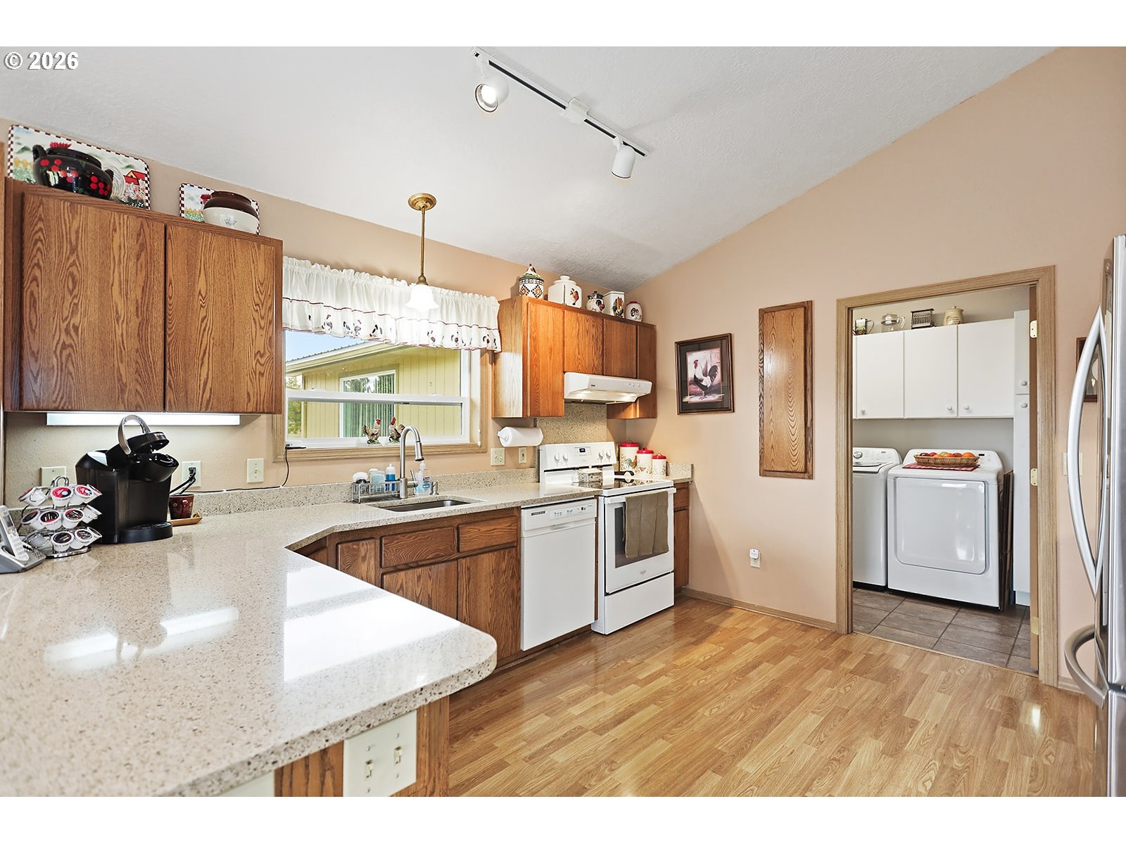 64 Seely Drive Goldendale, WA 98620 - Photo 11 of 46 a kitchen with granite countertop a refrigerator stove and sink