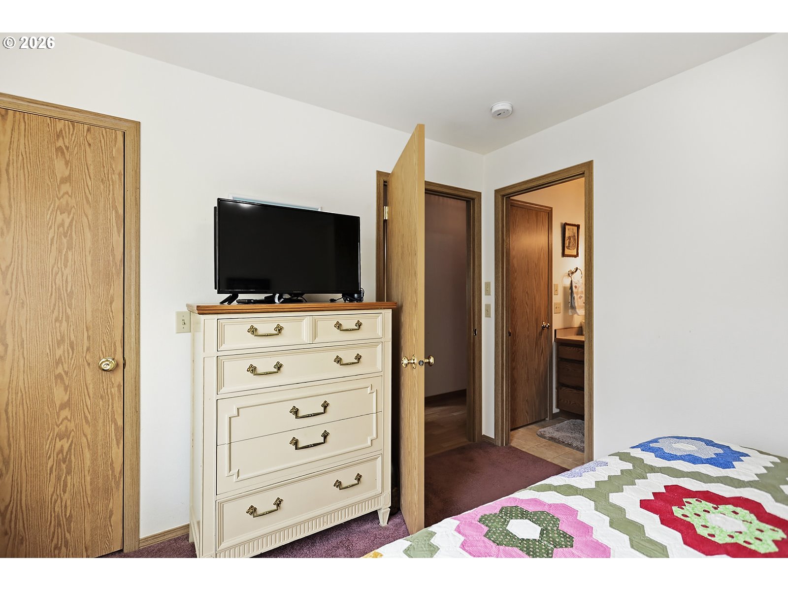 64 Seely Drive Goldendale, WA 98620 - Photo 23 of 46 a view of a bedroom with a flat screen tv