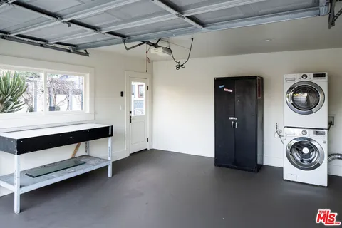 a utility room with closet dryer and washer