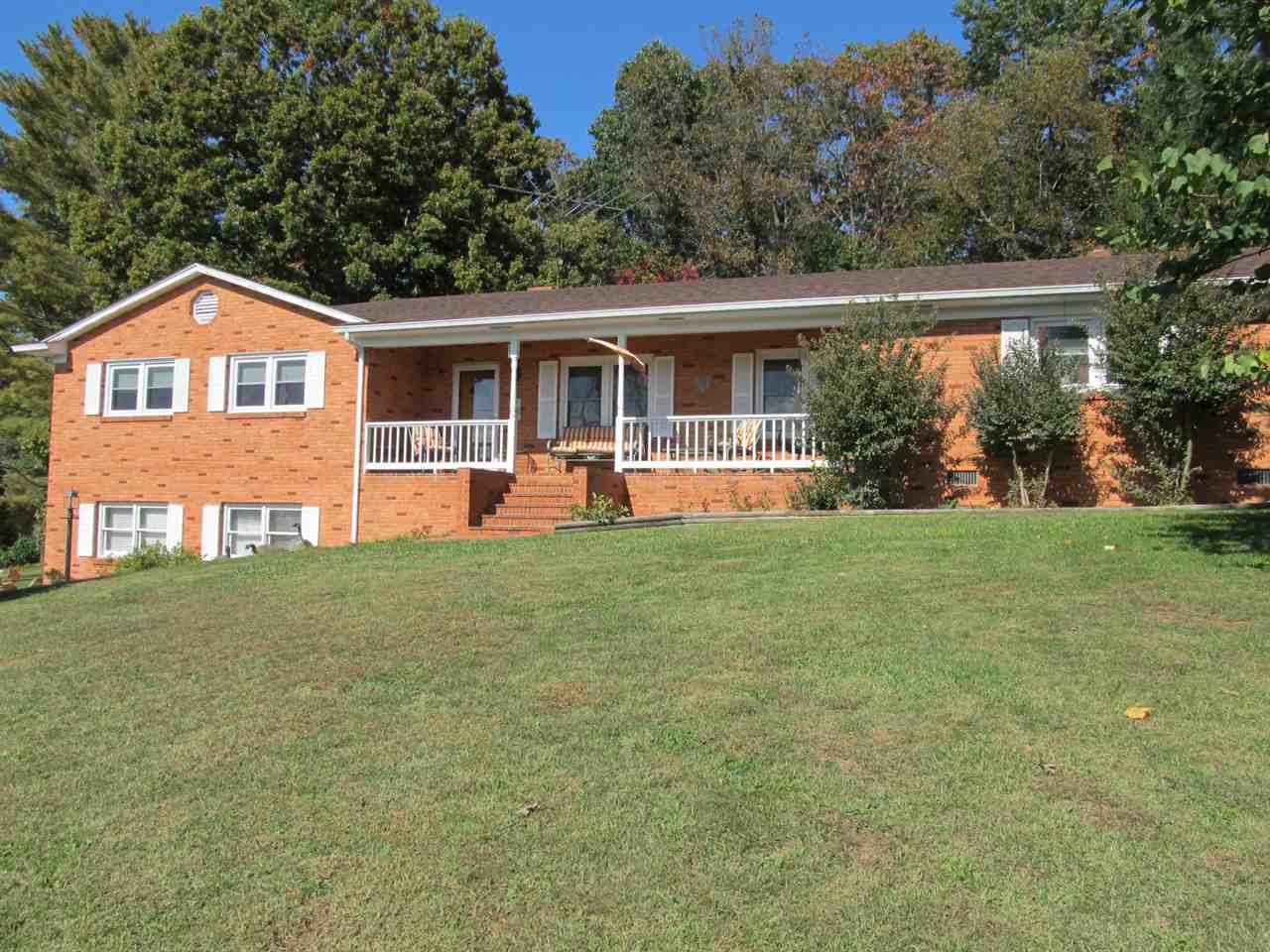 218 Dooms Crossing Road Waynesboro, VA 22980 - Photo 1 of 24 a front view of a house with a yard and trees