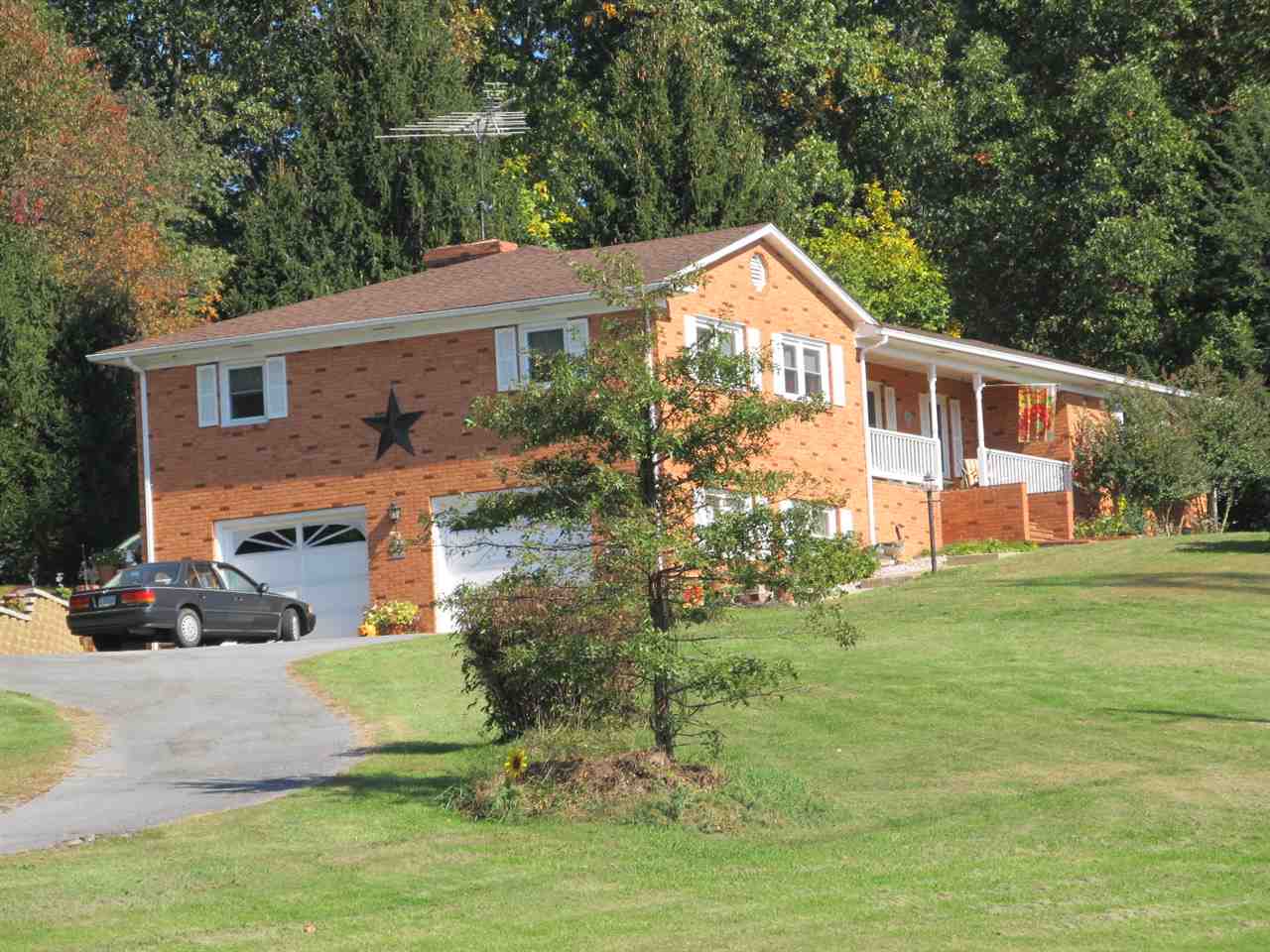 218 Dooms Crossing Road Waynesboro, VA 22980 - Photo 2 of 24 a front view of a house with a yard