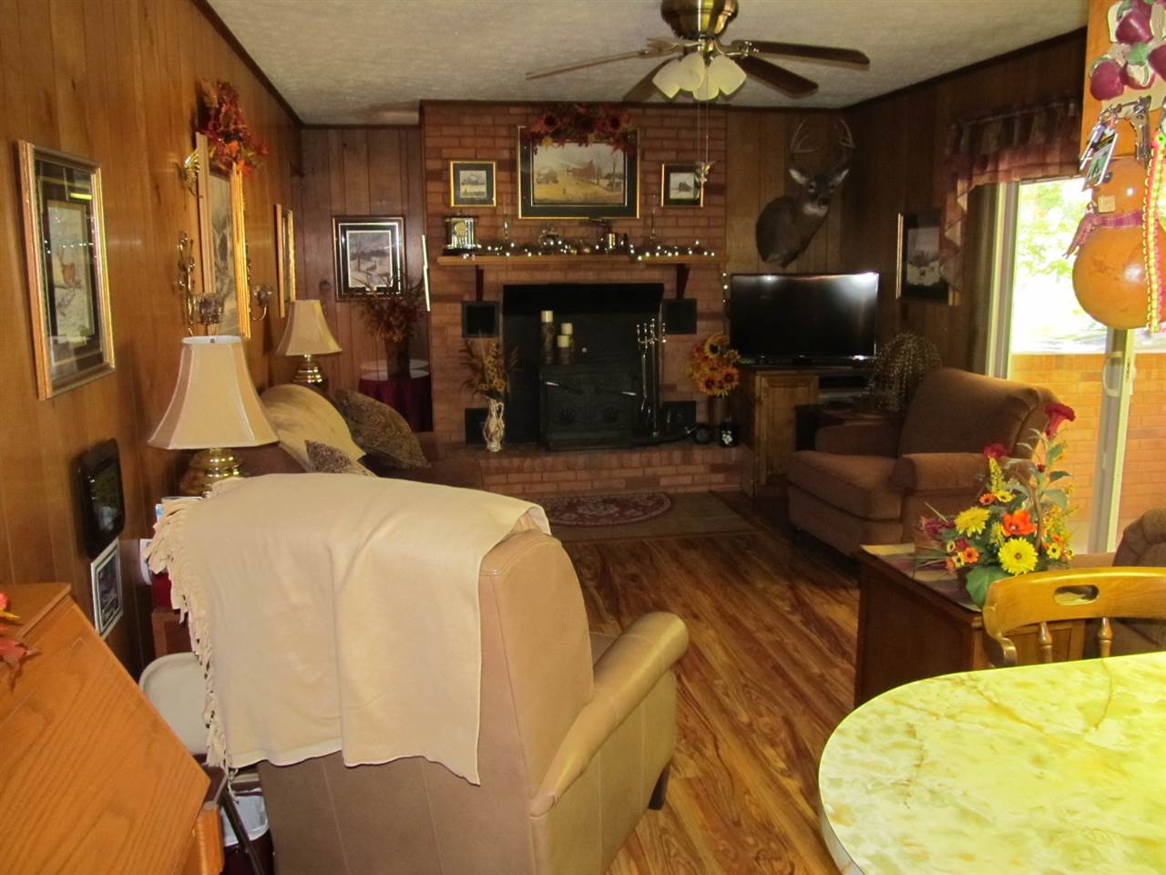 218 Dooms Crossing Road Waynesboro, VA 22980 - Photo 4 of 24 a living room with furniture a fireplace and a flat screen tv