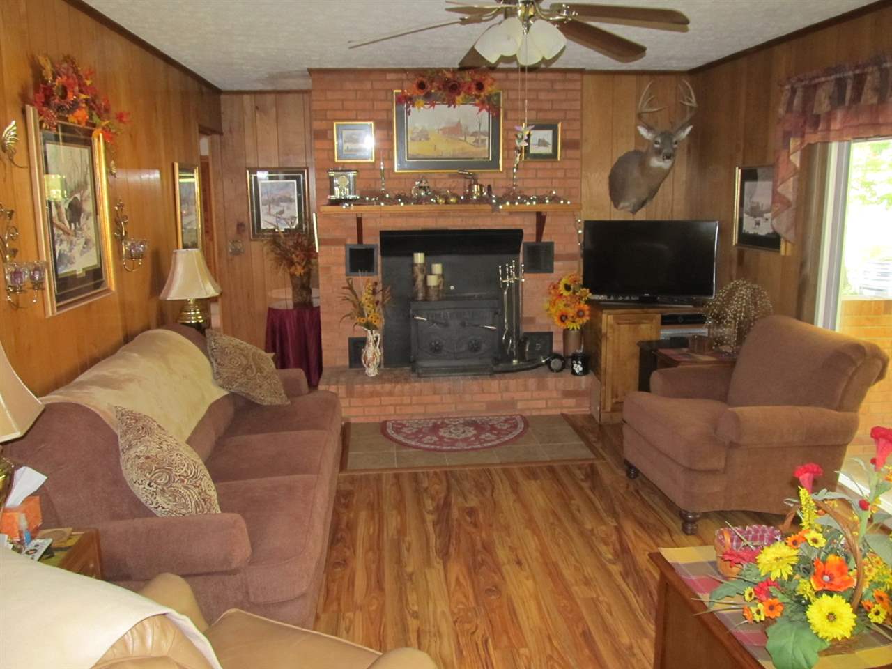 218 Dooms Crossing Road Waynesboro, VA 22980 - Photo 5 of 24 a living room with furniture a flat screen tv and a fireplace