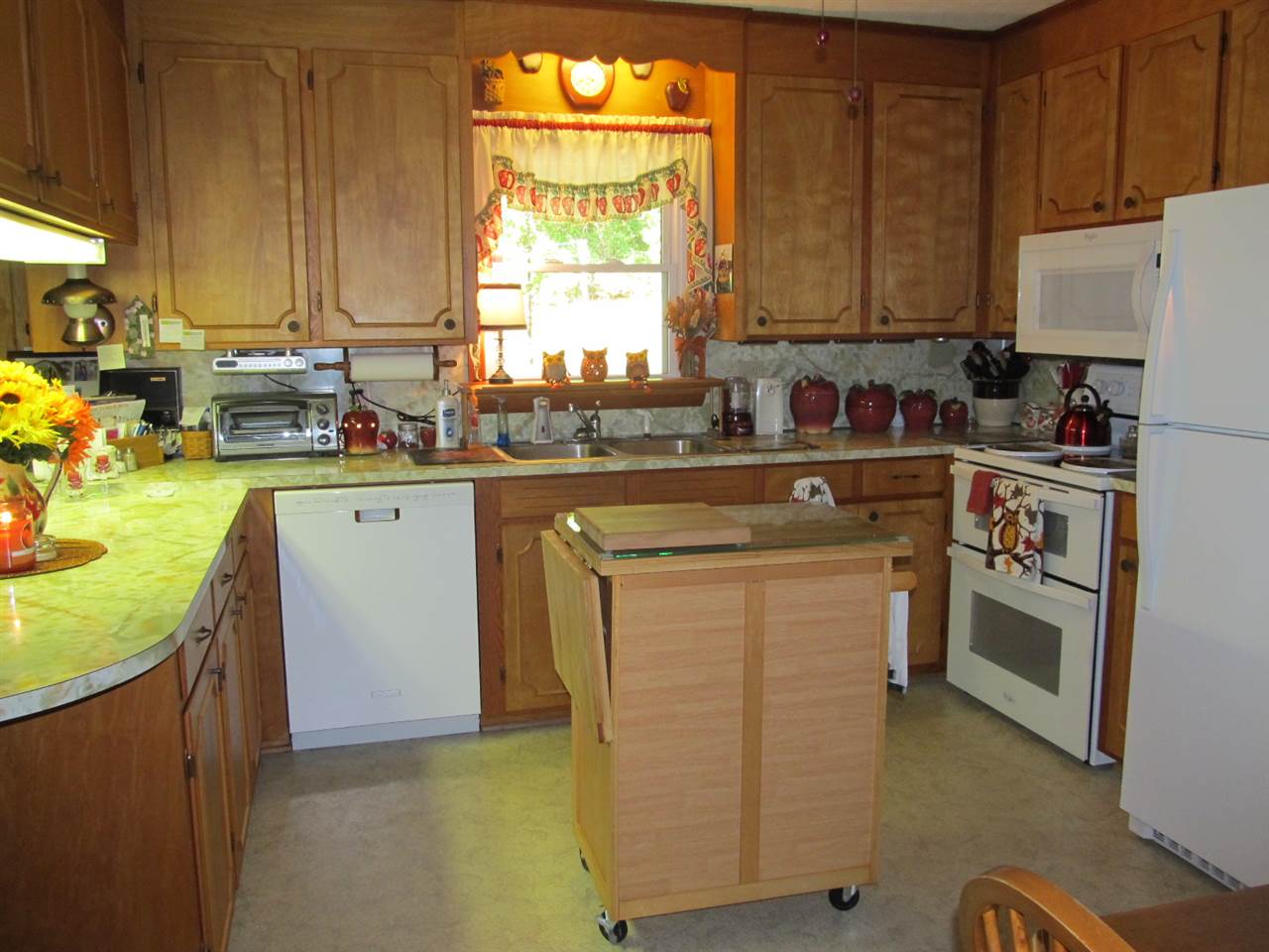 218 Dooms Crossing Road Waynesboro, VA 22980 - Photo 8 of 24 a kitchen with cabinets appliances a sink and a window