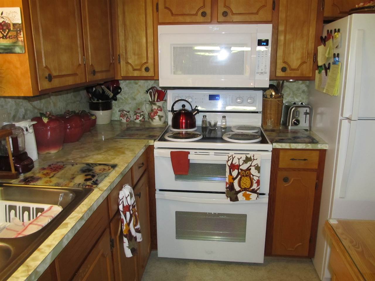 218 Dooms Crossing Road Waynesboro, VA 22980 - Photo 9 of 24 a kitchen with stainless steel appliances granite countertop a stove and a microwave