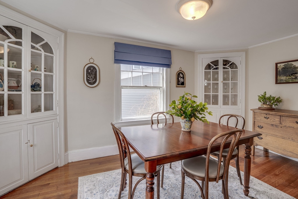 69 Bennett Street Wakefield, MA 01880 - Photo 11 of 27 a view of a dining room with furniture and wooden floor