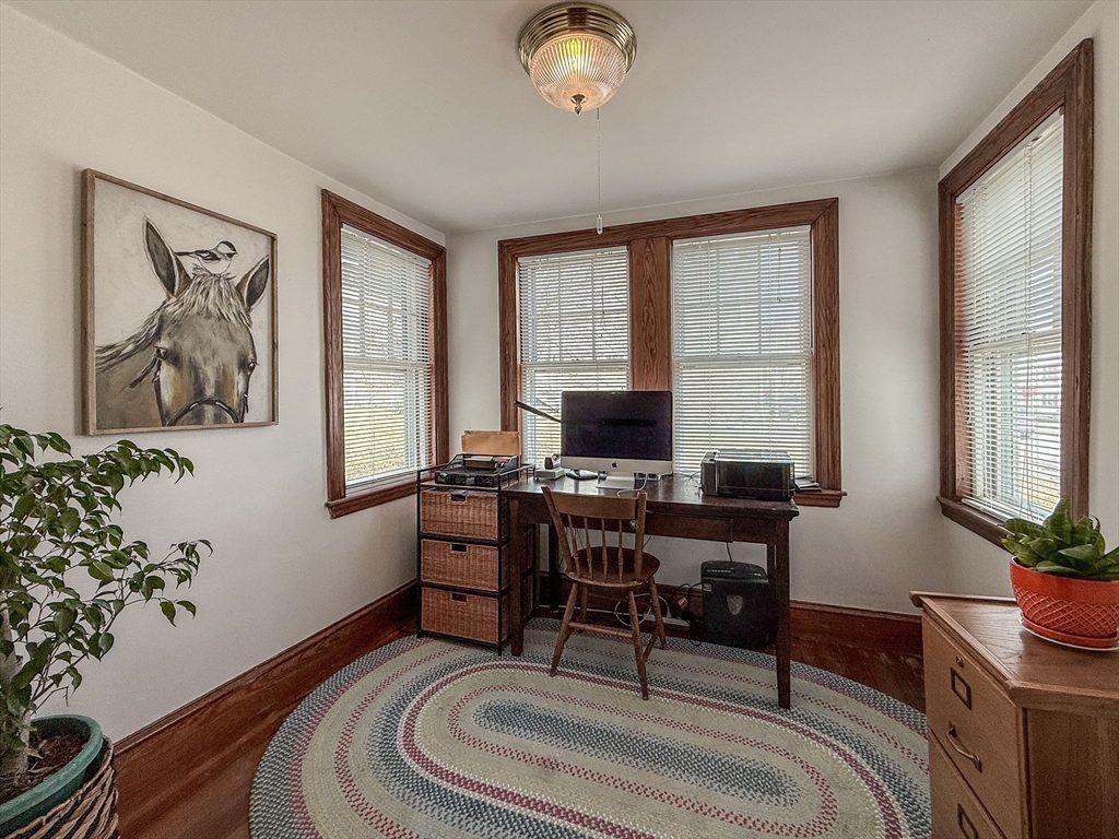 69 Bennett Street Wakefield, MA 01880 - Photo 16 of 27 a living room with furniture and a potted plant