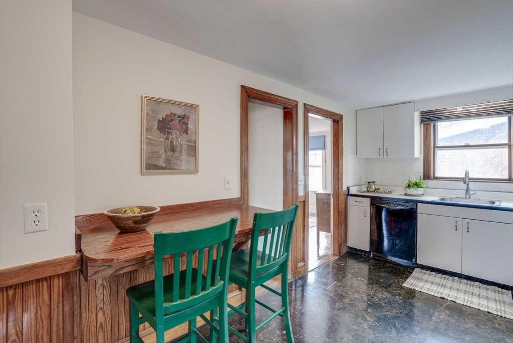 69 Bennett Street Wakefield, MA 01880 - Photo 17 of 27 a kitchen with stainless steel appliances granite countertop a stove a sink and a refrigerator