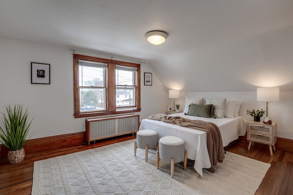 69 Bennett Street Wakefield, MA 01880 - Photo 20 of 27 a bedroom with a bed and a window