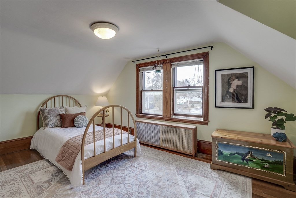 69 Bennett Street Wakefield, MA 01880 - Photo 21 of 27 a bedroom with a bed and a window