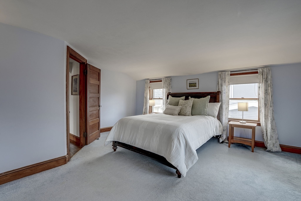 69 Bennett Street Wakefield, MA 01880 - Photo 23 of 27 a bed room with a bed and a window