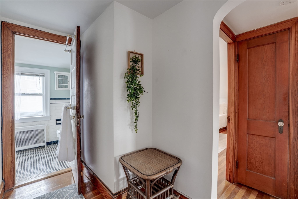 69 Bennett Street Wakefield, MA 01880 - Photo 25 of 27 a view of a room that has a bed and a table in it