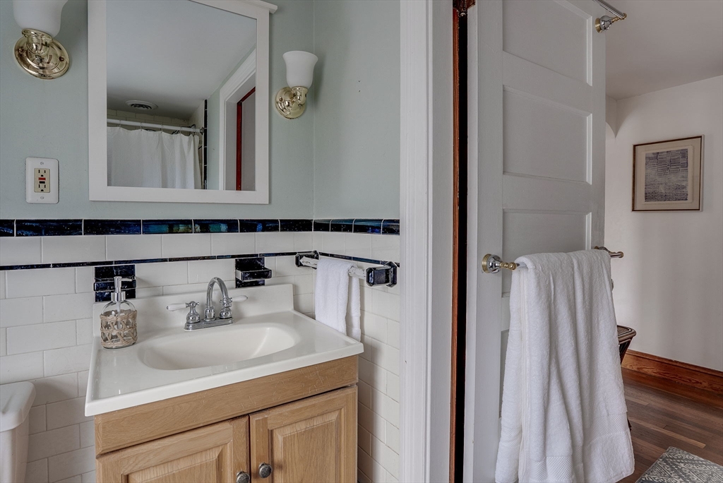 69 Bennett Street Wakefield, MA 01880 - Photo 27 of 27 a bathroom with a sink and a mirror