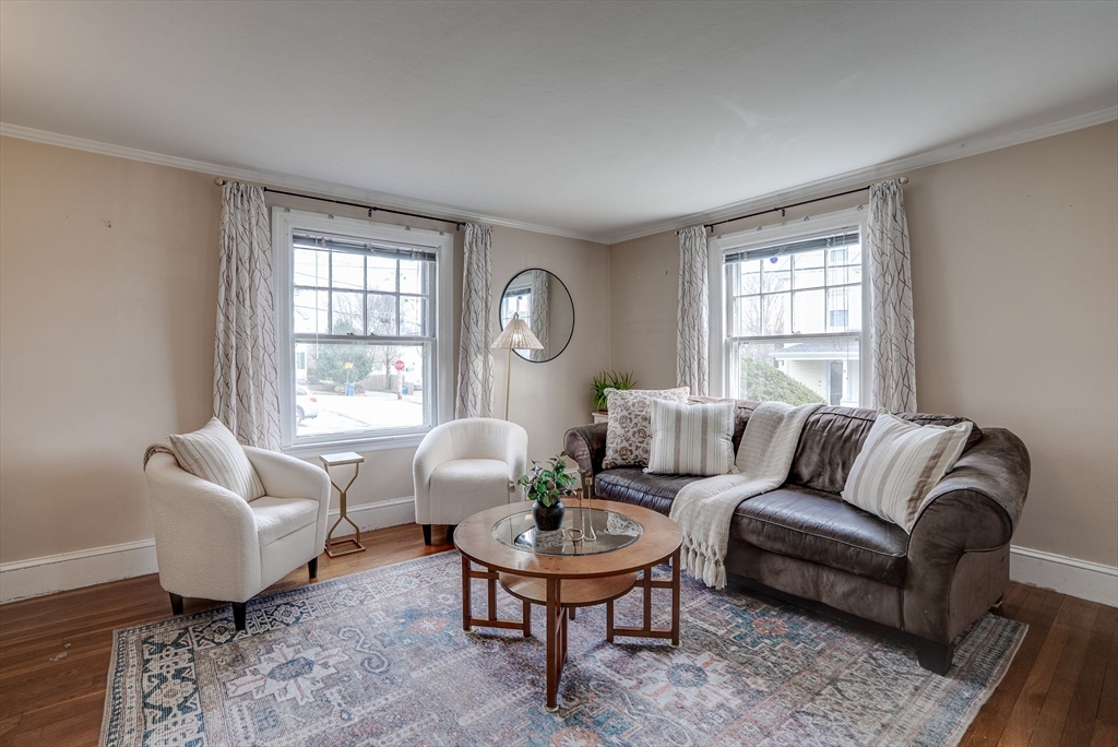 69 Bennett Street Wakefield, MA 01880 - Photo 6 of 27 a living room with furniture a rug a lamp and a window