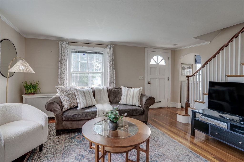 69 Bennett Street Wakefield, MA 01880 - Photo 8 of 27 a living room with furniture and a flat screen tv