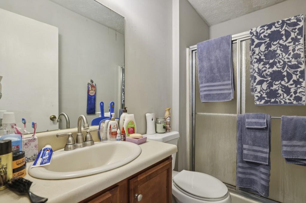 1331 North Hampton Road Alpharetta, GA 30009 - Photo 12 of 41 a bathroom with a sink toilet and shower