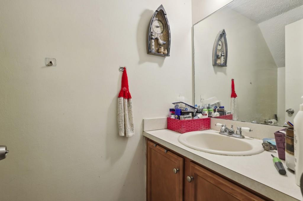 1331 North Hampton Road Alpharetta, GA 30009 - Photo 25 of 41 a bathroom with a sink and a mirror
