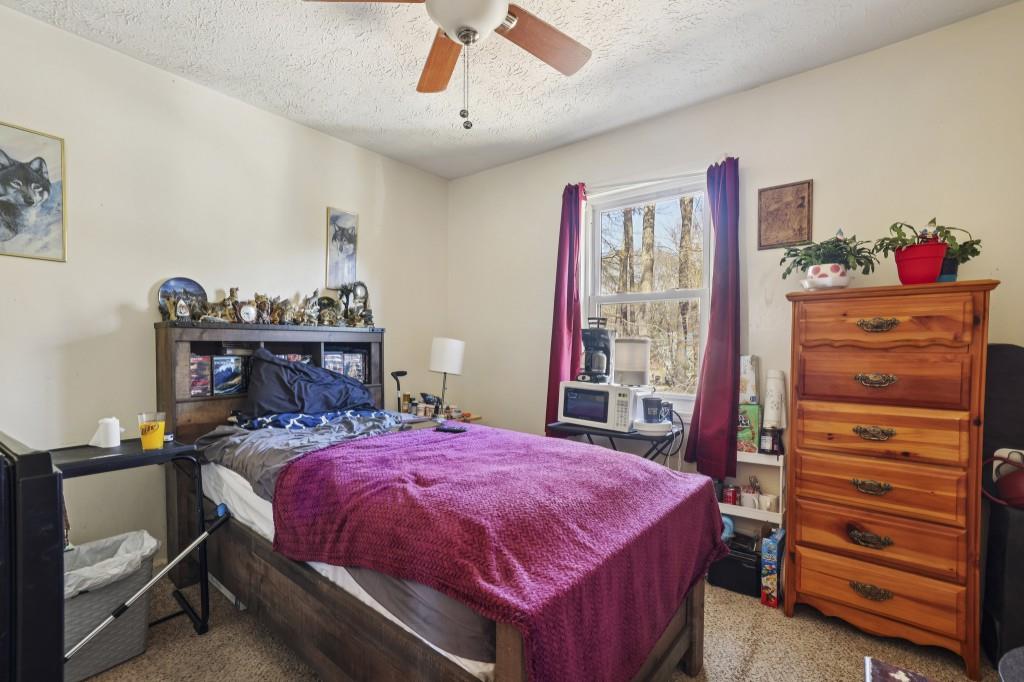 1331 North Hampton Road Alpharetta, GA 30009 - Photo 29 of 41 a bed room with a bed and a dresser
