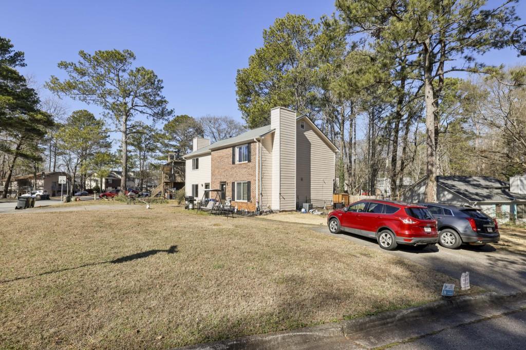 1331 North Hampton Road Alpharetta, GA 30009 - Photo 35 of 41 a cars parked in front of a house