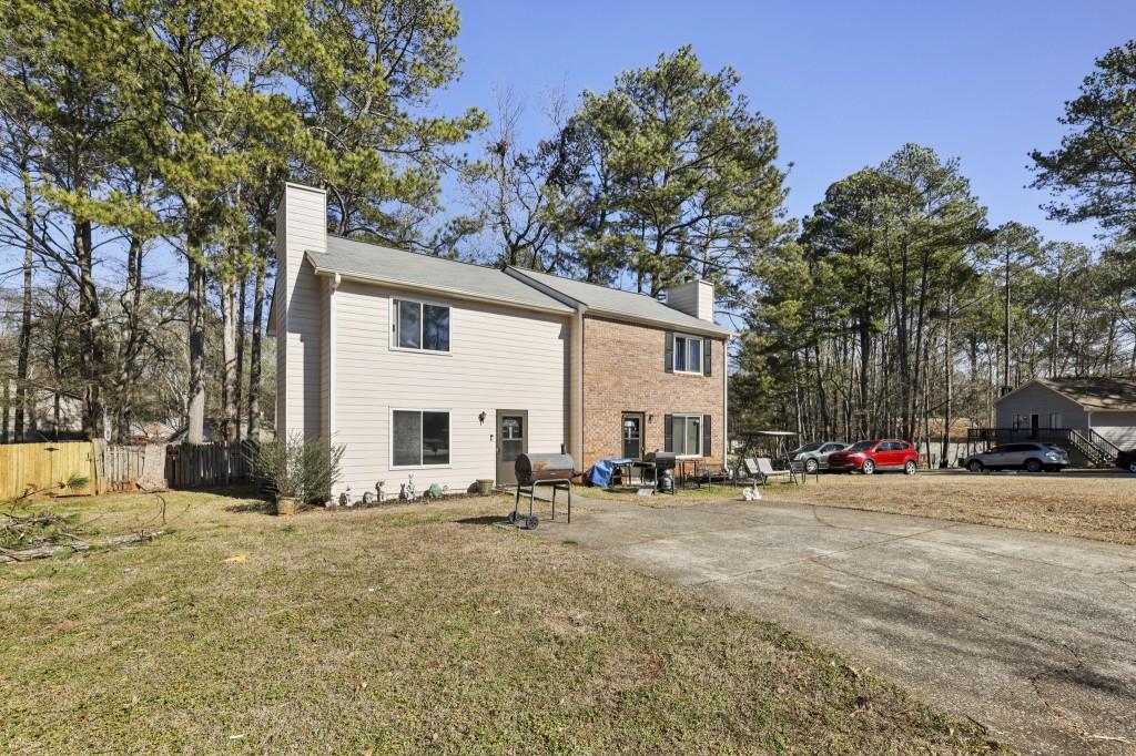1331 North Hampton Road Alpharetta, GA 30009 - Photo 41 of 41 a view of a white house with a large tree with yard and sitting area