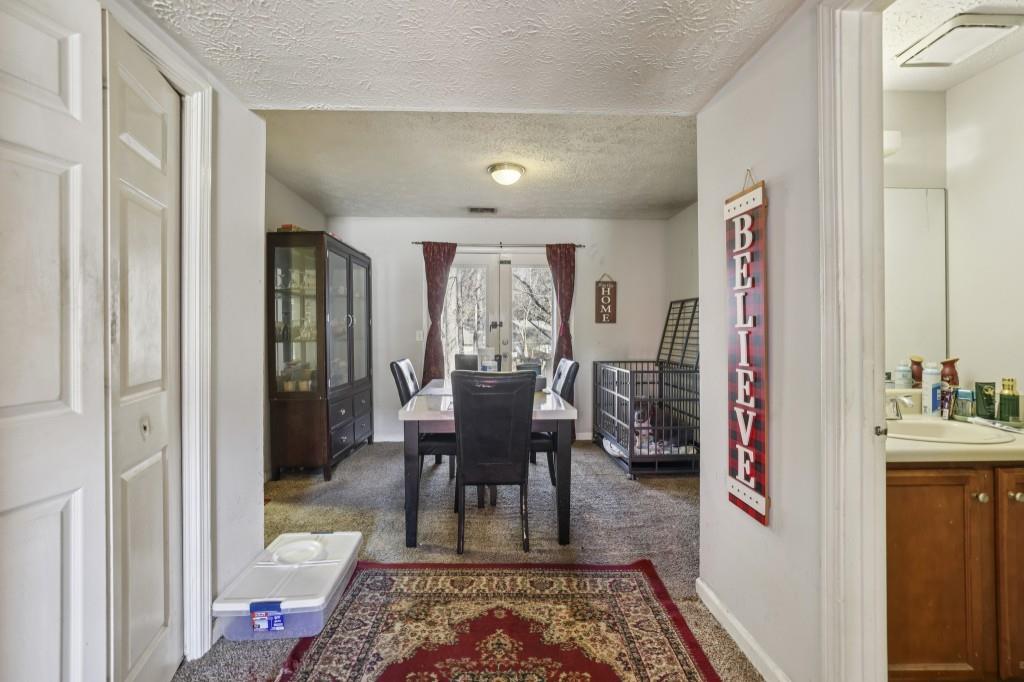 1331 North Hampton Road Alpharetta, GA 30009 - Photo 5 of 41 a living room with furniture and a rug