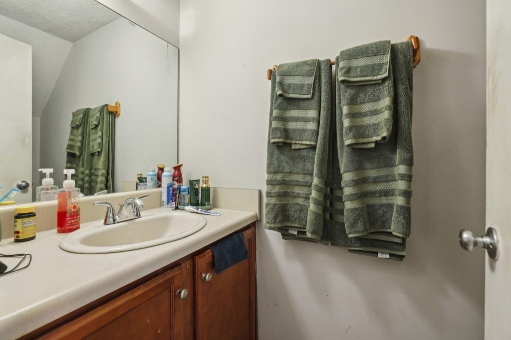 1331 North Hampton Road Alpharetta, GA 30009 - Photo 6 of 41 a bathroom with a sink double vanity and a mirror