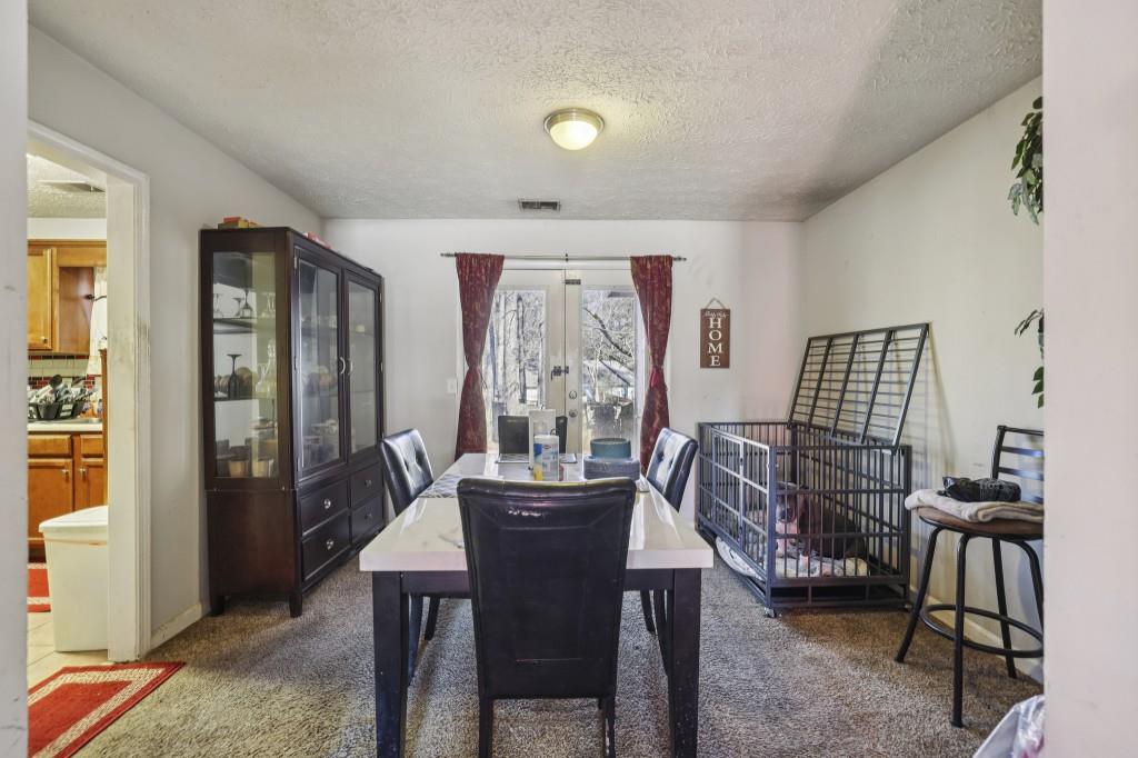 1331 North Hampton Road Alpharetta, GA 30009 - Photo 7 of 41 a view of a dining room with furniture window and outside view