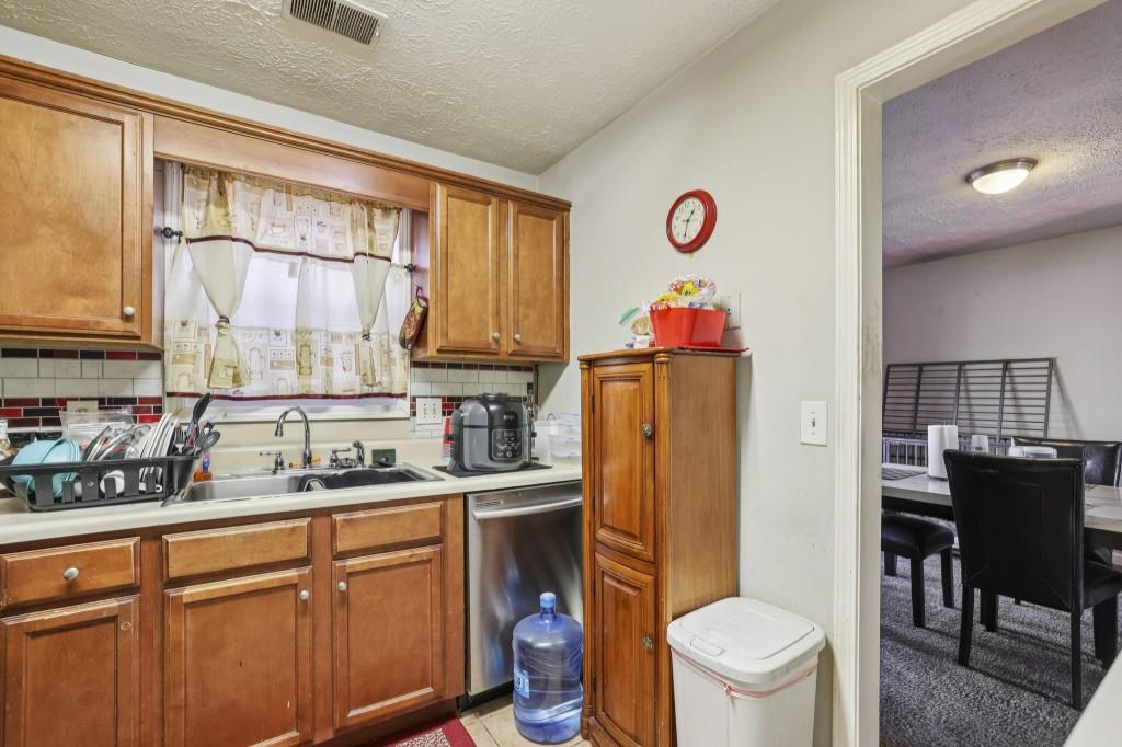 1331 North Hampton Road Alpharetta, GA 30009 - Photo 8 of 41 a kitchen with a sink cabinets and wooden floor