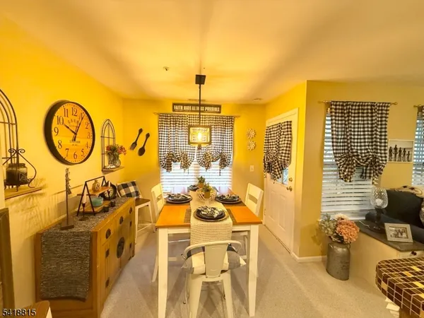 a view of a swimming pool with furniture