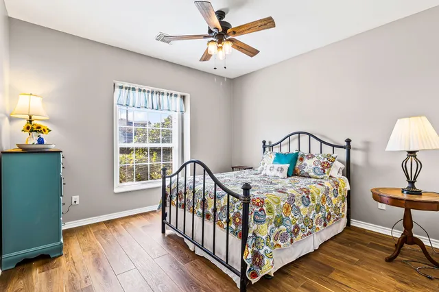 a white toilet sitting next to a shower curtain