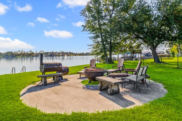 a view of a lake with a garden and houses