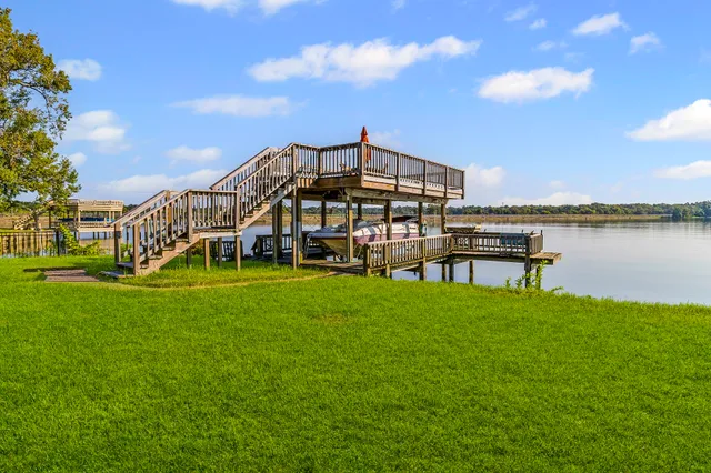 a swimming pool with outdoor seating and garden