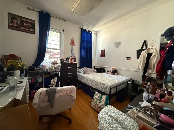 a living room with furniture a rug and a window