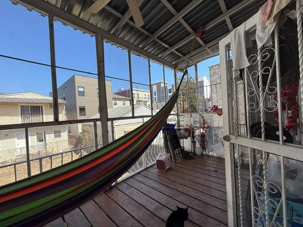 a view of balcony with wooden floor and stairs
