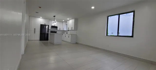 a view of a refrigerator and window