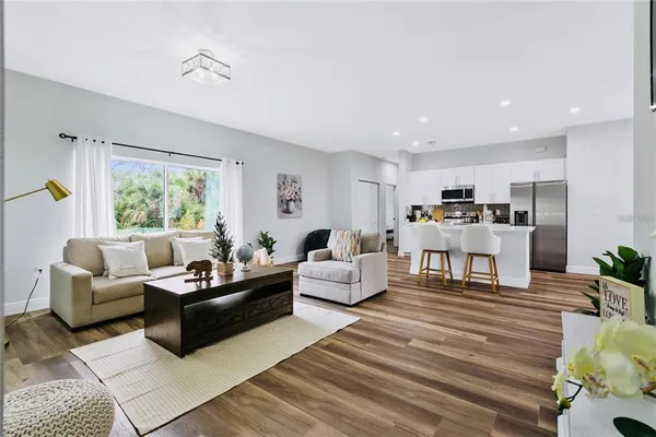 a living room with furniture and a large window