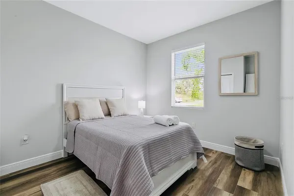 a view of a room with wooden floor