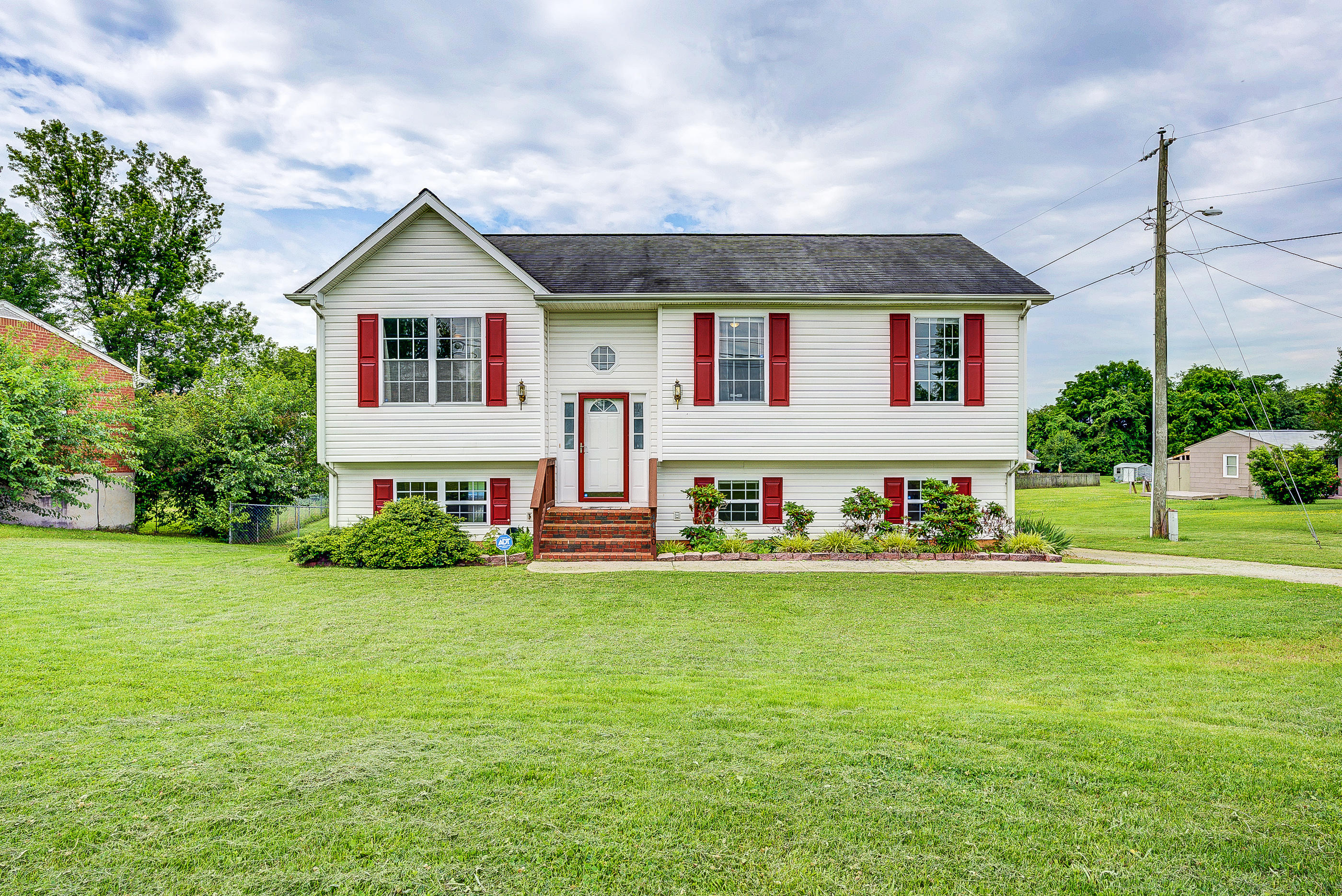 4410 Cove Road Roanoke, VA 24017 - Photo 1 of 32 a front view of a house with a yard