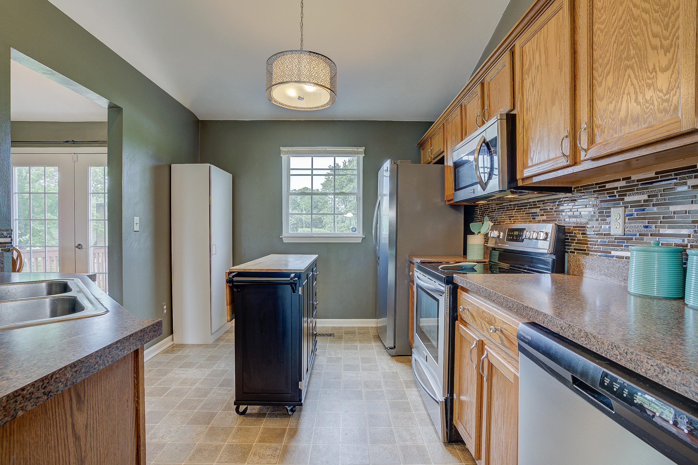 4410 Cove Road Roanoke, VA 24017 - Photo 14 of 32 a kitchen with refrigerator cabinets and a sink