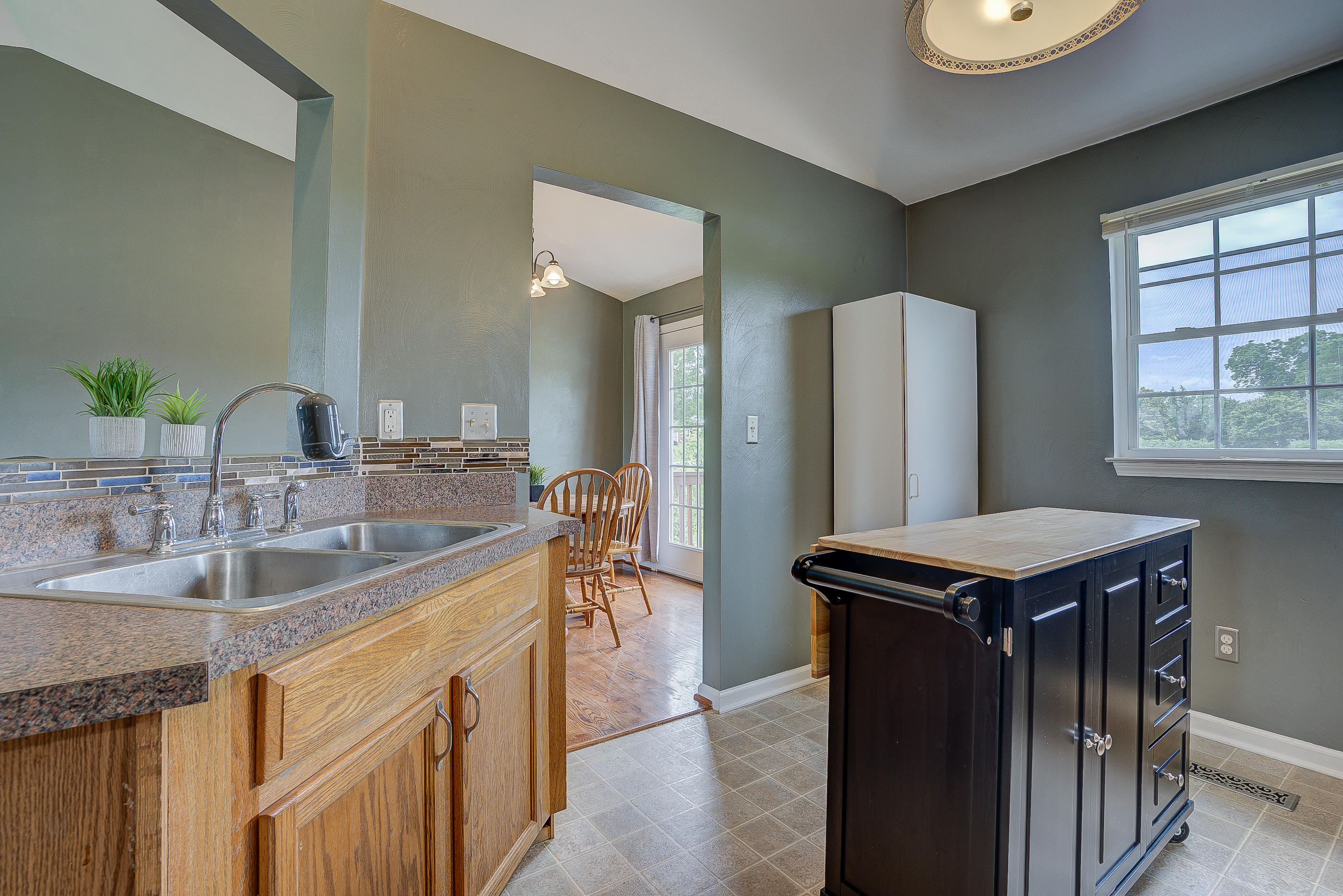 4410 Cove Road Roanoke, VA 24017 - Photo 15 of 32 a kitchen with sink refrigerator and window