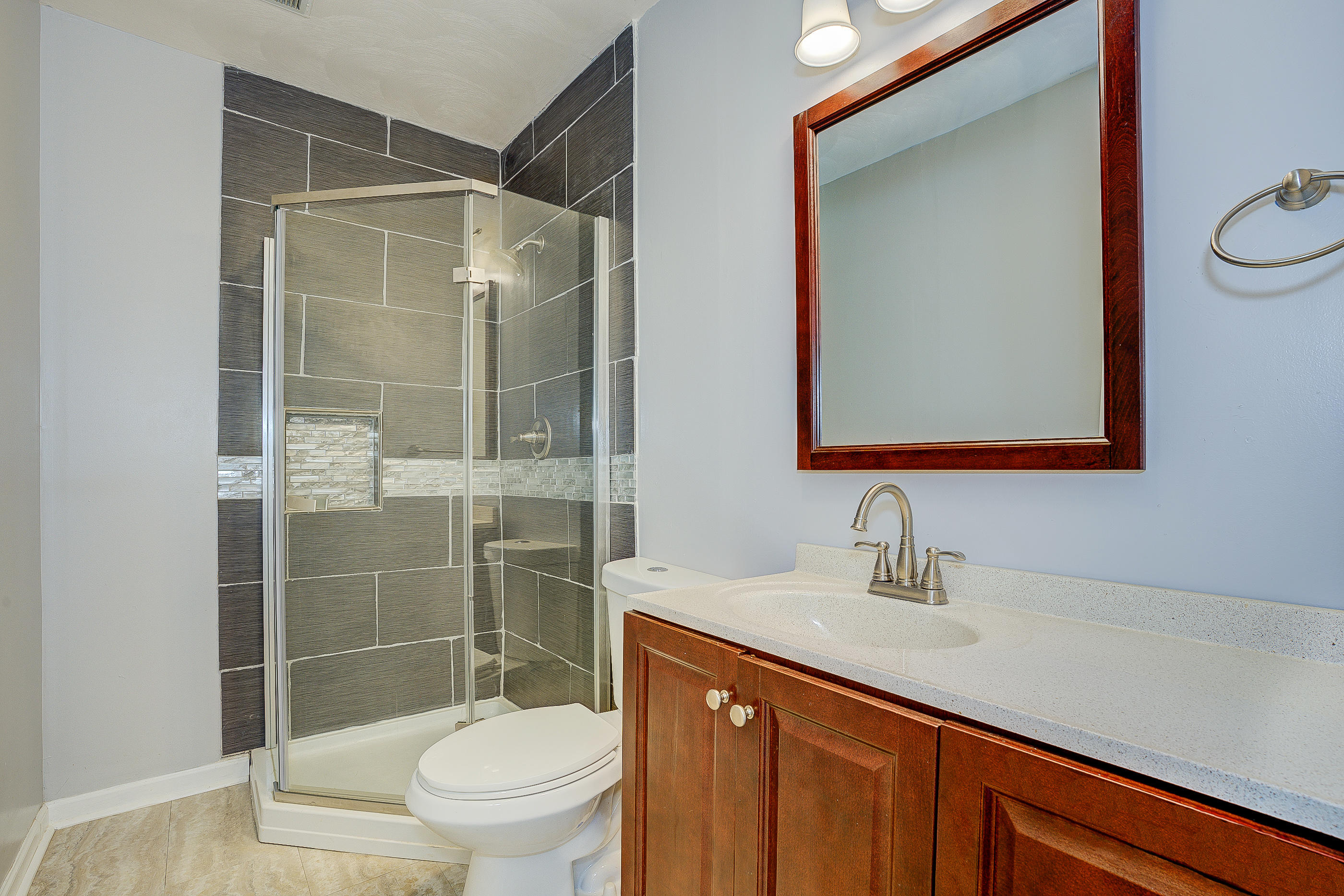 4410 Cove Road Roanoke, VA 24017 - Photo 17 of 32 a bathroom with a sink a toilet and shower