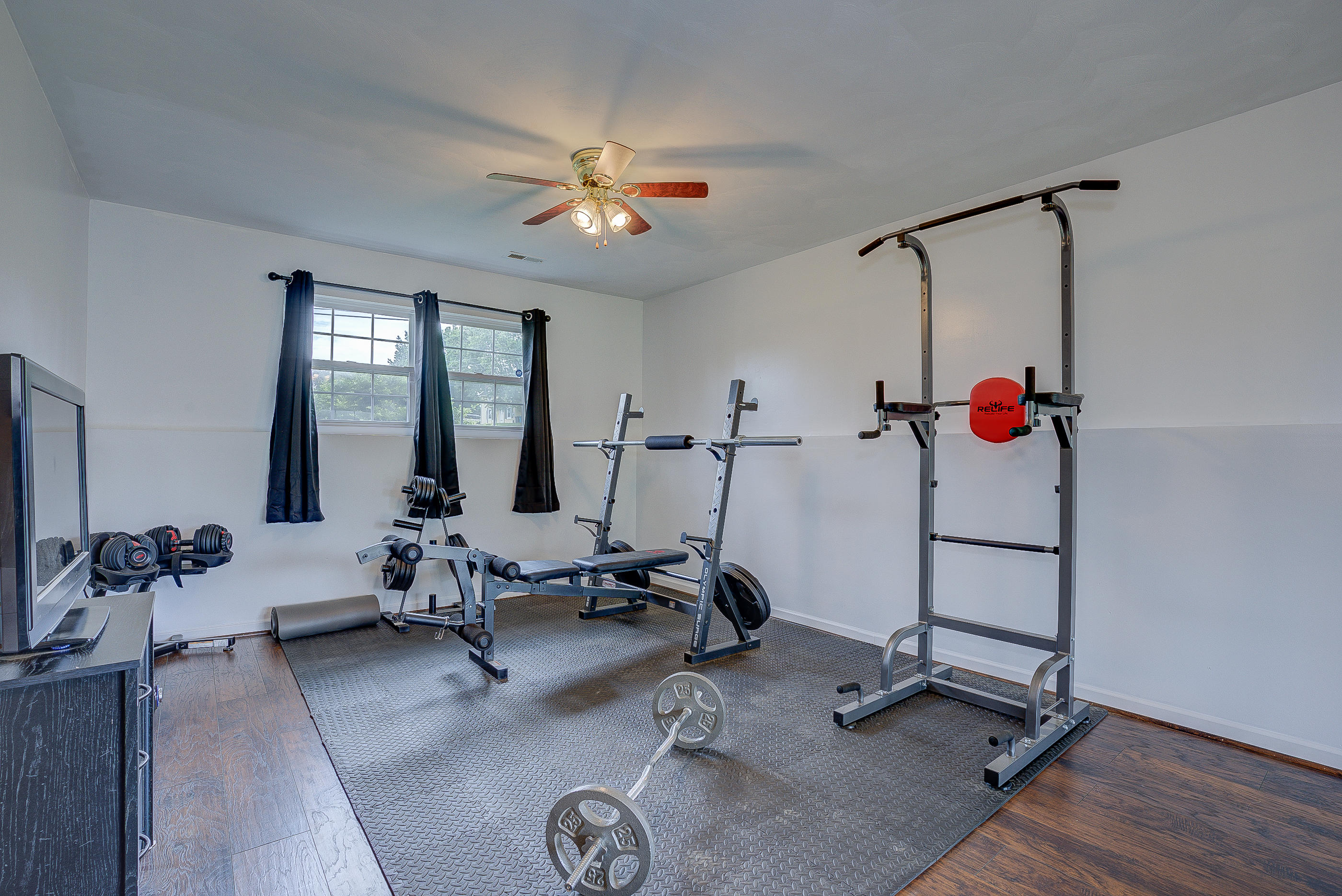 4410 Cove Road Roanoke, VA 24017 - Photo 22 of 32 a room with gym equipment and view of living room