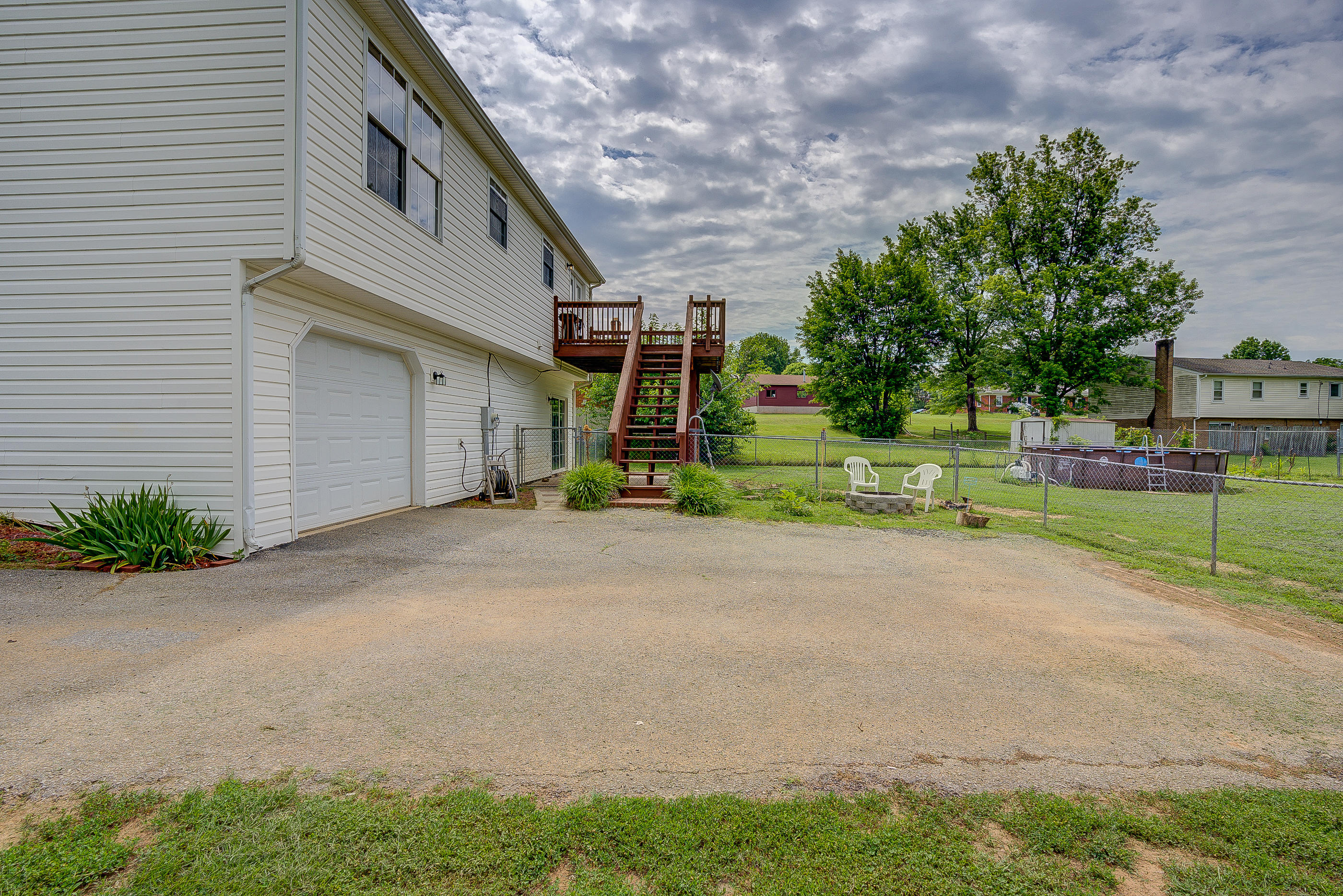 4410 Cove Road Roanoke, VA 24017 - Photo 30 of 32 a front view of a house with a yard and trees