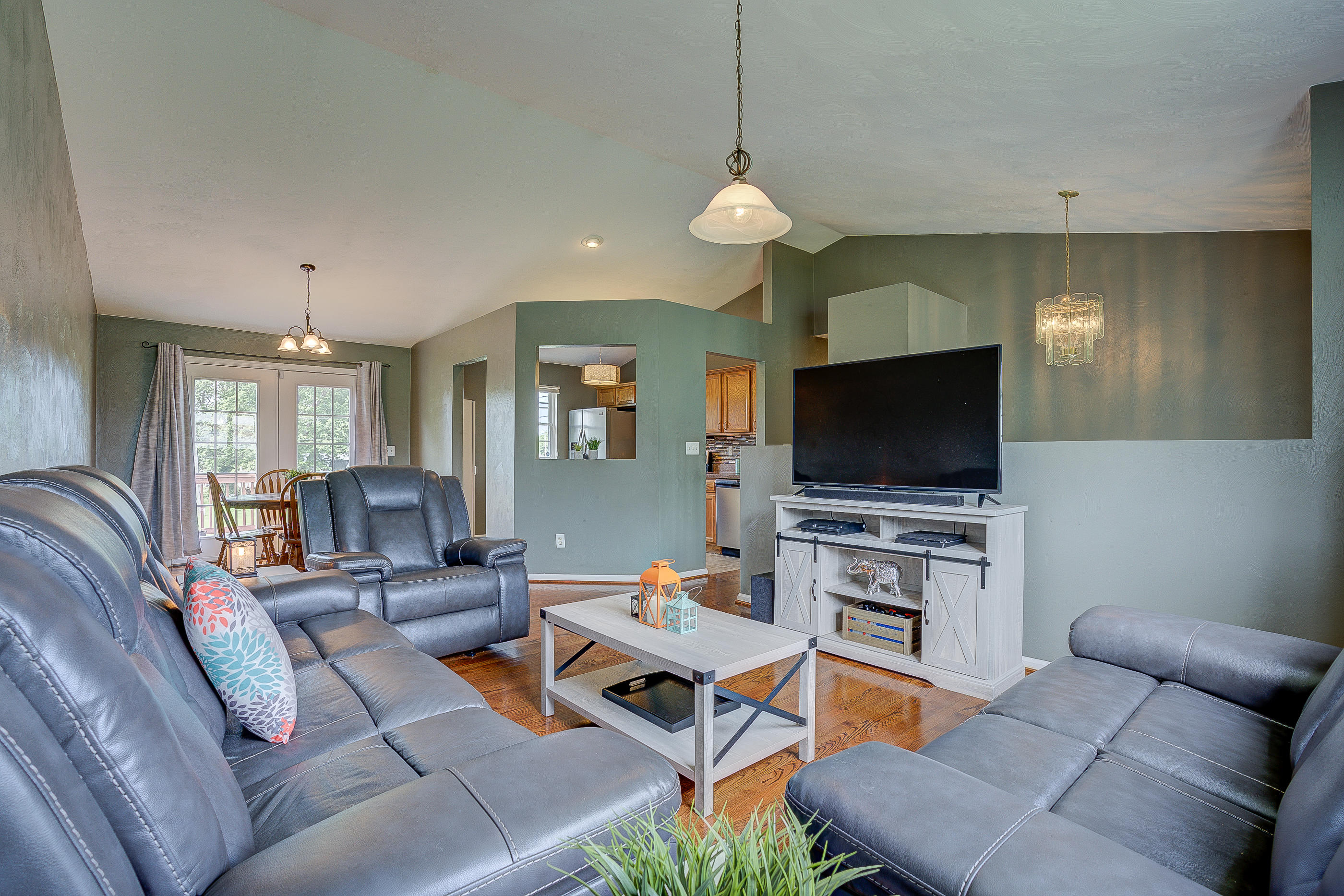 4410 Cove Road Roanoke, VA 24017 - Photo 5 of 32 a living room with furniture and a flat screen tv