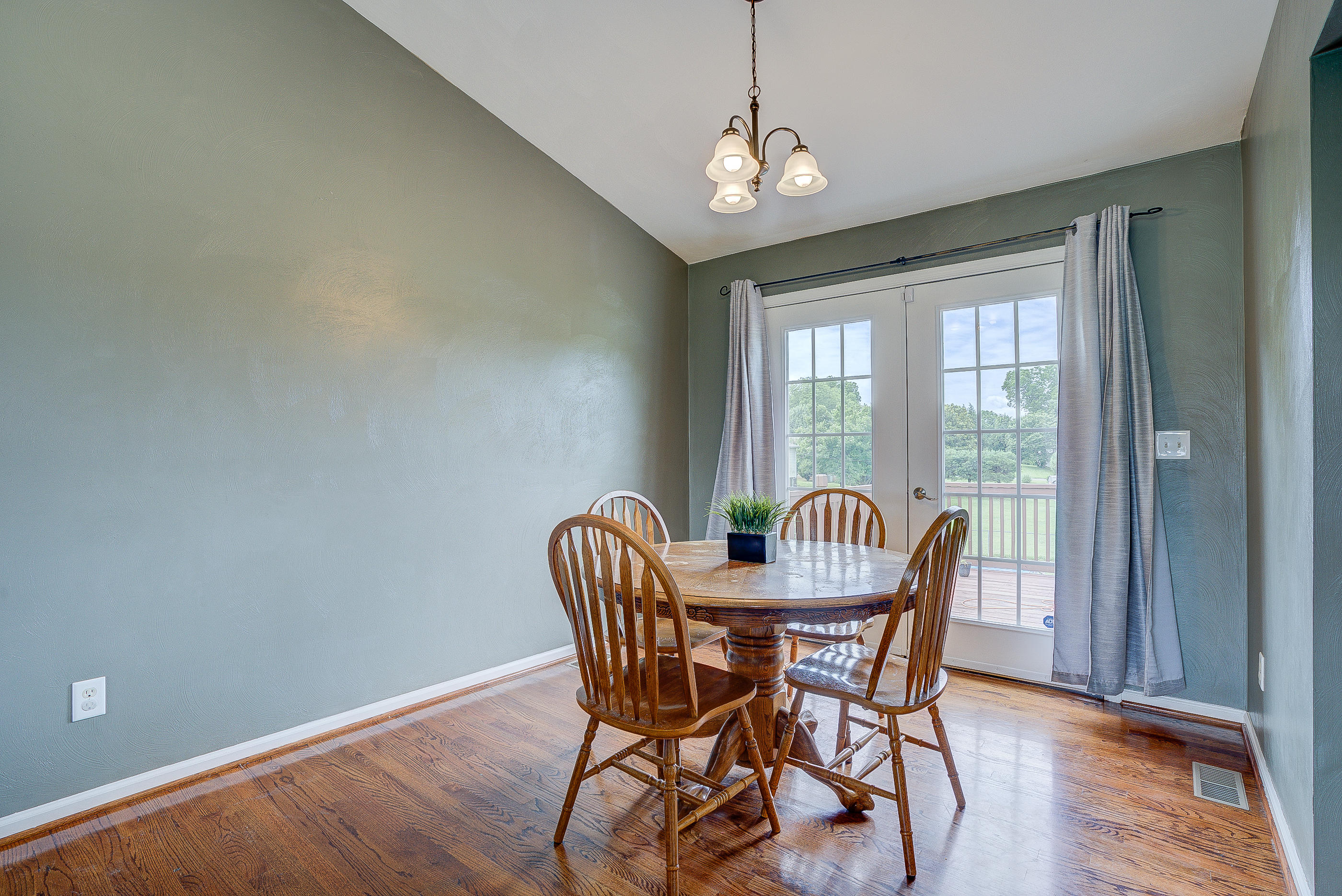 4410 Cove Road Roanoke, VA 24017 - Photo 6 of 32 a view of a dining room with furniture wooden floor and chandelier